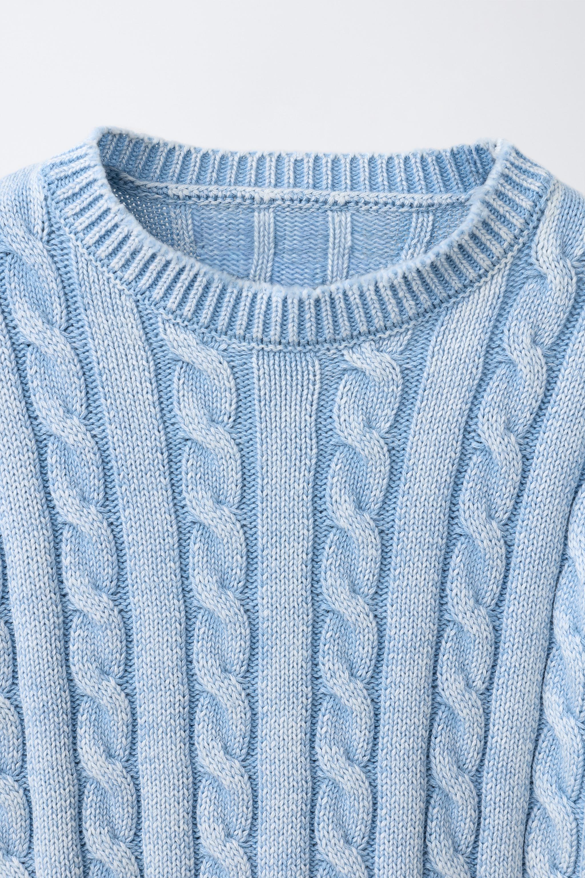 PULL EN MAILLE À TORSADES DÉLAVÉ